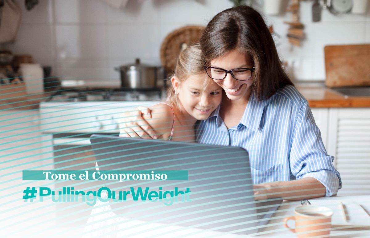 Woman and her daughter looking at a computer